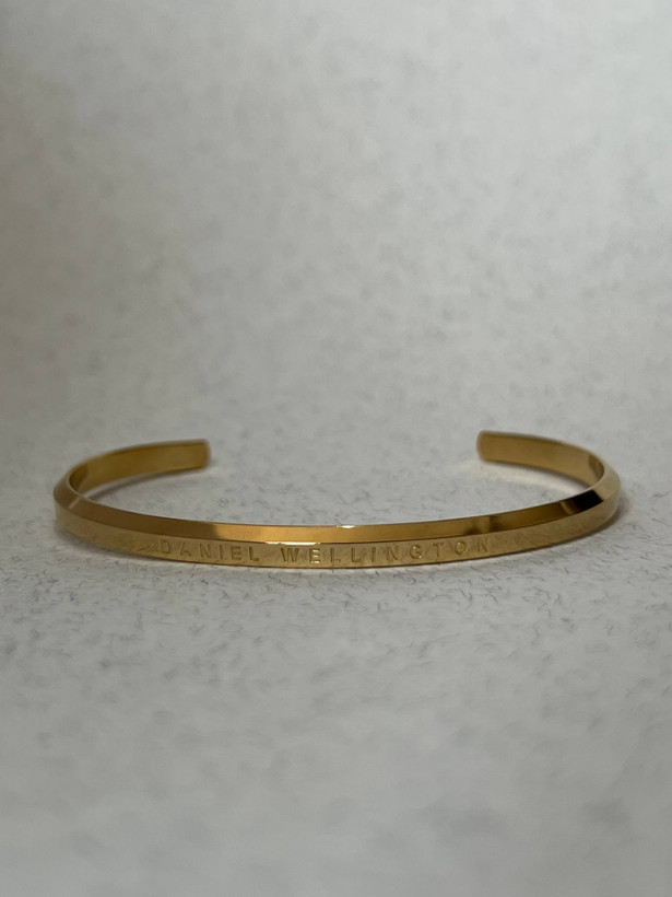 دستبند بنگل مردانه دانیل ولینگتون مشکی و طلایی(DW Minimal Cuff) – استیل رنگ ثابت